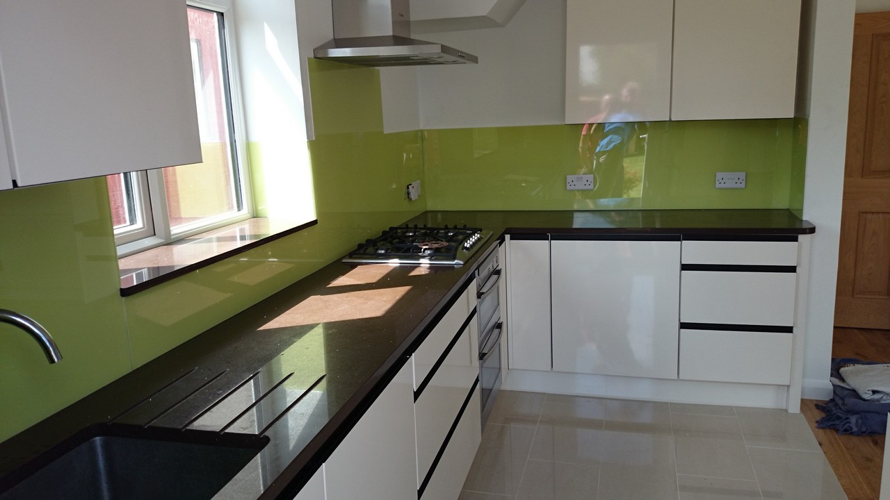 Lime green glass kitchen splashback installed by Potters Bar glaziers