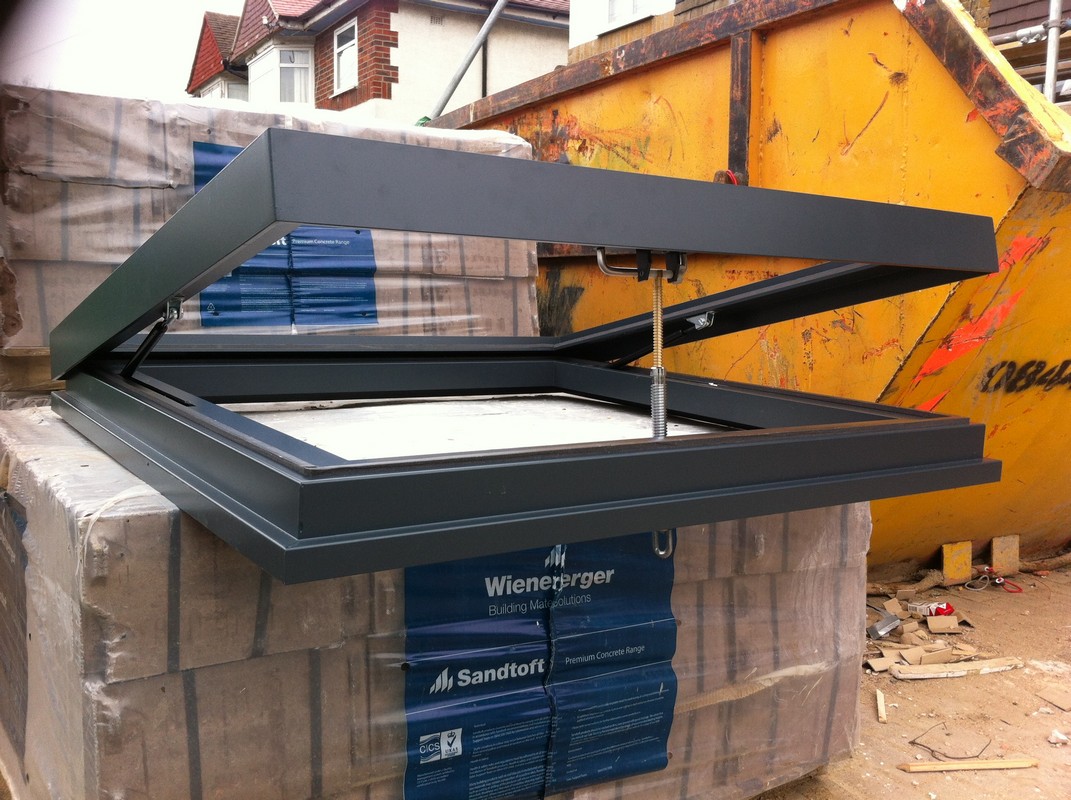 Opening flat roof skylight in anthracite grey installed in Potters Bar